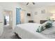 Comfortable bedroom with a ceiling fan, dresser, TV, and a glimpse into the bathroom at 3008 Church St. # D3, Myrtle Beach, SC 29577