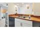 A well lit kitchen featuring wood countertops, updated cabinetry, and stainless steel appliances at 3008 Church St. # D3, Myrtle Beach, SC 29577