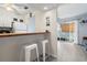 Charming kitchen featuring white cabinets, breakfast bar, wood countertop, and tiled backsplash at 3008 Church St. # D3, Myrtle Beach, SC 29577
