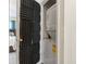 Efficient laundry closet with stacked washer and dryer featuring custom soundproofing at 3008 Church St. # D3, Myrtle Beach, SC 29577