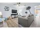 Living room featuring modern decor, ceiling fan, and a decorative wall at 3008 Church St. # D3, Myrtle Beach, SC 29577