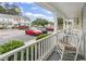Cozy patio view with a rocking chair overlooking the parking area and complex at 3008 Church St. # D3, Myrtle Beach, SC 29577