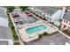 Aerial view of a well-maintained community pool and parking area for townhomes at 3008 Church St. # D3, Myrtle Beach, SC 29577