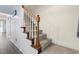 Classic staircase with wooden banister and carpeted steps, adding charm to the home's interior at 3008 Church St. # D3, Myrtle Beach, SC 29577