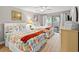Bright bedroom features two beds with decorative bedding and access to a private balcony at 306 Westbury Ct. # 2-B, Myrtle Beach, SC 29572