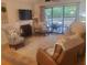 Cozy living room featuring a fireplace, comfortable seating, and slider access to an outdoor patio at 306 Westbury Ct. # 2-B, Myrtle Beach, SC 29572