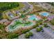 Aerial view of the community pool featuring a lazy river, pool and spa at 3334 Volterra Way # 3334, Myrtle Beach, SC 29579