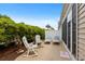 Backyard featuring a patio, rocking chairs, lounge seating, and lush greenery for privacy at 3334 Volterra Way # 3334, Myrtle Beach, SC 29579