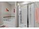 Bright bathroom featuring a tiled shower and a soaking tub at 3334 Volterra Way # 3334, Myrtle Beach, SC 29579