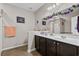Well-lit bathroom with double vanity, modern fixtures, and ample counter space at 3334 Volterra Way # 3334, Myrtle Beach, SC 29579