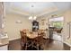 Comfortable dining room featuring a wooden table, chandelier lighting, and seamless access to the living room at 3334 Volterra Way # 3334, Myrtle Beach, SC 29579
