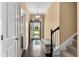 Welcoming entryway with wooden floors, offering a glimpse of the living area and stairway access at 3334 Volterra Way # 3334, Myrtle Beach, SC 29579