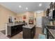 Spacious kitchen featuring granite countertops, stainless appliances, and an island at 3334 Volterra Way # 3334, Myrtle Beach, SC 29579