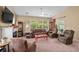 Bright living room with large windows, neutral walls, and comfortable seating area at 3334 Volterra Way # 3334, Myrtle Beach, SC 29579