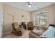 Cozy living room with natural light, comfortable seating, ceiling fan, and neutral color palette at 3334 Volterra Way # 3334, Myrtle Beach, SC 29579