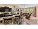 Bright living room with a fireplace, vaulted ceilings, and an open layout to the kitchen and dining area at 3334 Volterra Way # 3334, Myrtle Beach, SC 29579