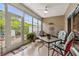 Bright sunroom with large windows, comfortable seating, and access to the outdoors at 3334 Volterra Way # 3334, Myrtle Beach, SC 29579