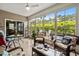 Relaxing sunroom featuring comfortable seating, plenty of natural light, and views of the outdoor patio at 3334 Volterra Way # 3334, Myrtle Beach, SC 29579