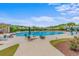 Community swimming pool featuring chairs, umbrellas and a view of townhomes at 3334 Volterra Way # 3334, Myrtle Beach, SC 29579