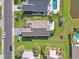Aerial view of the home showcasing its well-manicured lawn, patio, and proximity to a serene lake at 347 Kessinger Dr., Surfside Beach, SC 29575