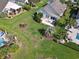 Expansive backyard featuring lush landscaping, a patio, and a charming pergola, perfect for outdoor entertaining at 347 Kessinger Dr., Surfside Beach, SC 29575