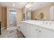 Bright bathroom with double sinks, a shower, tile floors and plenty of counter space at 347 Kessinger Dr., Surfside Beach, SC 29575