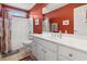 Bright bathroom with a white vanity, red walls, and a shower/tub combination at 347 Kessinger Dr., Surfside Beach, SC 29575