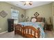 Comfortable bedroom featuring a ceiling fan, warm colors, and a well-lit window at 347 Kessinger Dr., Surfside Beach, SC 29575