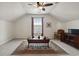 Spacious bonus room with a ceiling fan, decorative rug, and natural light at 347 Kessinger Dr., Surfside Beach, SC 29575