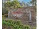 Elegant stone community sign with decorative water features, surrounded by lush greenery and landscaping at 347 Kessinger Dr., Surfside Beach, SC 29575