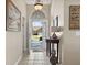 Inviting foyer with tiled floor, decorative mirror, and a view of the front yard at 347 Kessinger Dr., Surfside Beach, SC 29575