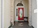 Inviting front entrance with a decorative red door and unique architectural details at 347 Kessinger Dr., Surfside Beach, SC 29575