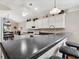 Modern kitchen featuring white cabinets, stainless appliances, and barstool seating at 347 Kessinger Dr., Surfside Beach, SC 29575