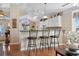 Bright kitchen with barstool seating, hardwood floors and white cabinetry at 347 Kessinger Dr., Surfside Beach, SC 29575