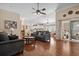 Open living room with hardwood floors offering views into the kitchen and a sitting room at 347 Kessinger Dr., Surfside Beach, SC 29575
