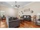 Comfortable living room featuring hardwood floors, neutral paint, and gray sofas at 347 Kessinger Dr., Surfside Beach, SC 29575