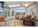Bright sunroom with large windows, wicker furniture, and plenty of natural light at 347 Kessinger Dr., Surfside Beach, SC 29575
