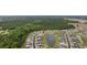 Aerial view of a home nestled in a community with a beautiful pond and lush landscaping at 362 Shallow Cove Dr., Conway, SC 29527