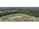 Aerial view of a home nestled in a community with a beautiful pond and lush landscaping at 362 Shallow Cove Dr., Conway, SC 29527