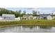 Well-maintained backyard and patio offer a serene view of the pond and surrounding greenery at 362 Shallow Cove Dr., Conway, SC 29527