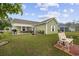 Home boasts a spacious backyard with patio, seating, grill, and beautiful landscaping at 362 Shallow Cove Dr., Conway, SC 29527