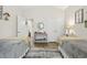 Bedroom with two beds, vaulted ceiling, and view into the hallway; features neutral colors and wood-look flooring at 362 Shallow Cove Dr., Conway, SC 29527