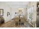 Bright dining area featuring modern chandelier and decorative wall shelves at 362 Shallow Cove Dr., Conway, SC 29527