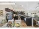 Modern kitchen with dark cabinets, stainless steel appliances, and an adjacent dining area at 362 Shallow Cove Dr., Conway, SC 29527