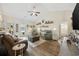 Open-concept living room adjacent to kitchen, with hardwood floors and neutral tones at 362 Shallow Cove Dr., Conway, SC 29527