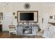 Comfortable living room featuring a stone fireplace, TV, and decorative accents at 362 Shallow Cove Dr., Conway, SC 29527