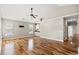 Spacious living room featuring vaulted ceilings, hardwood floors, and abundant natural light from several windows at 374 Graytwig Circle, Murrells Inlet, SC 29576