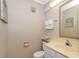 Bathroom features a single sink vanity, decorative mirror, and neutral wall color at 415 Ocean Creek Dr. # 2245, Myrtle Beach, SC 29572