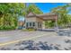 Community entrance gate featuring a guardhouse, well-manicured landscaping, and street access at 415 Ocean Creek Dr. # 2245, Myrtle Beach, SC 29572