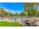 Inviting pool and hot tub area with lounge chairs, tables, and chairs for relaxation at 415 Ocean Creek Dr. # 2245, Myrtle Beach, SC 29572